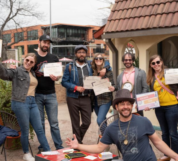 Friends playing Escape the Box, a real world escape game. Austin’s premiere group activity. Perfect for team building, celebrations, and large group activities.