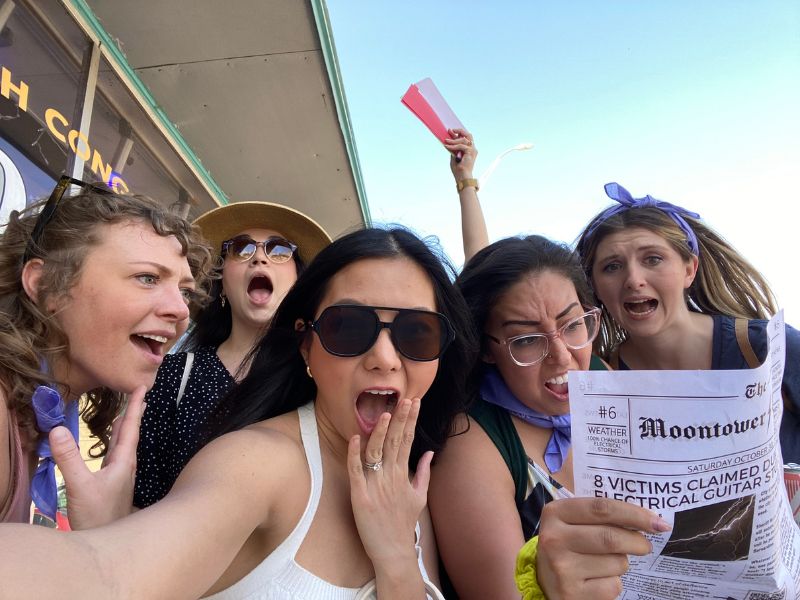 Friends playing Escape the Box, an outdoor escape game, in Austin, TX