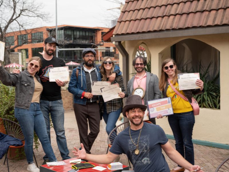 Friends playing Escape the Box, an outdoor escape game, in Austin, TX