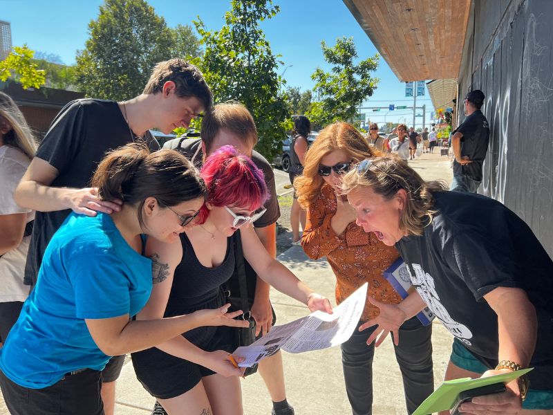 Family playing Escape the Box, an outdoor escape game, in Austin, TX